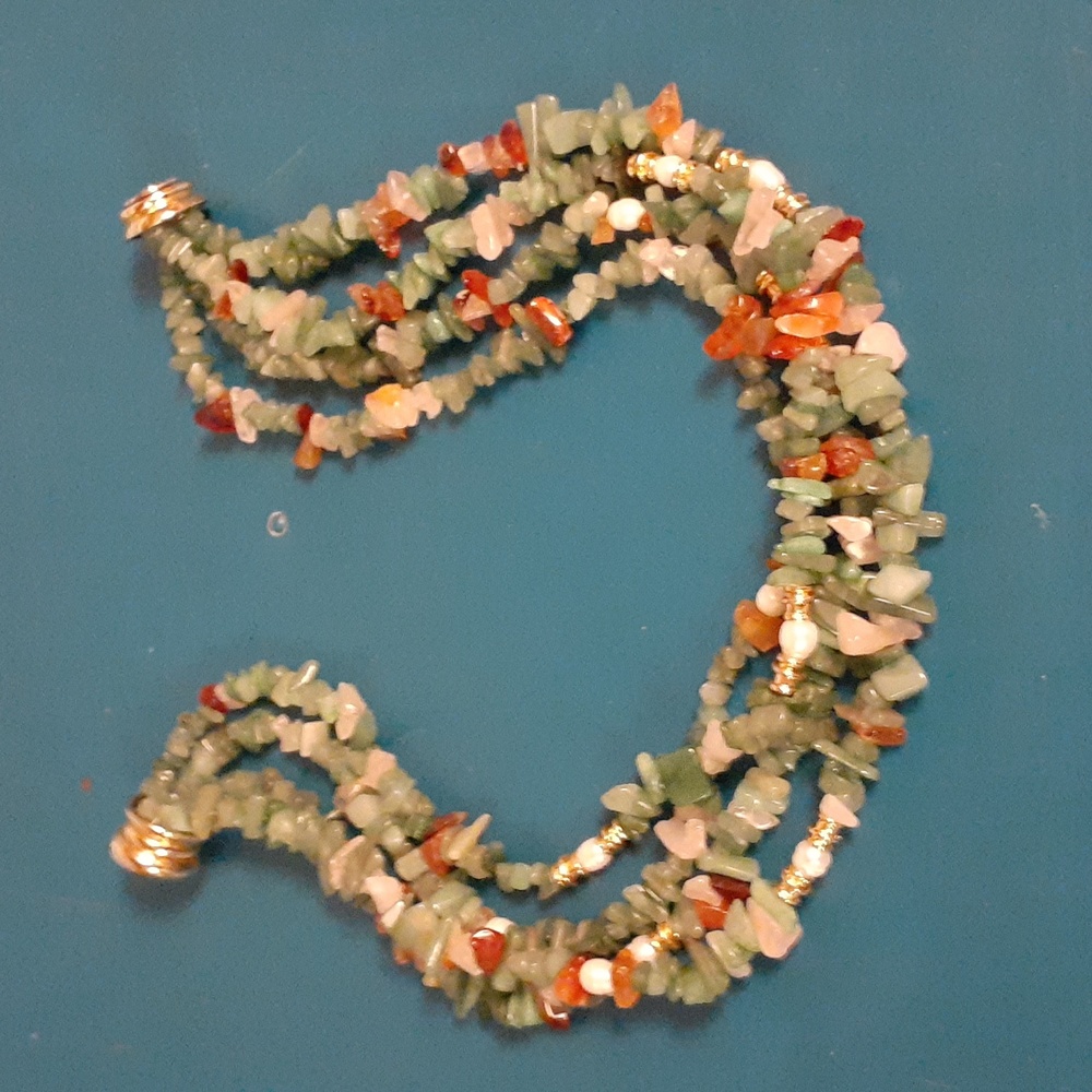 4 strand beaded green, coral, and white necklace. Elegant!